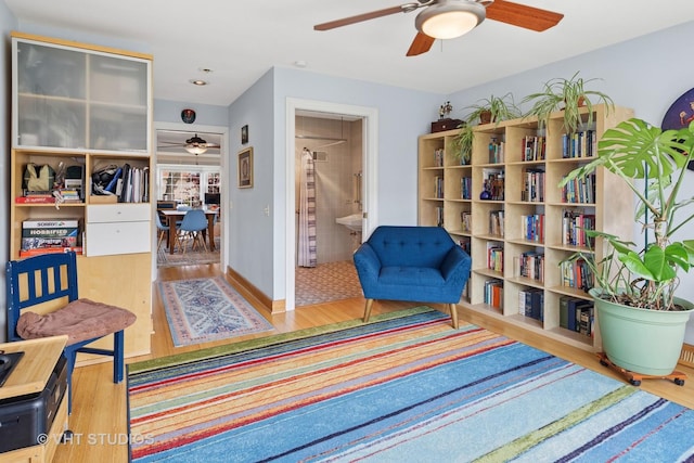 6967 W Wolfram St, Chicago, IL 60634 - living area with ceiling fan and wood finished floors