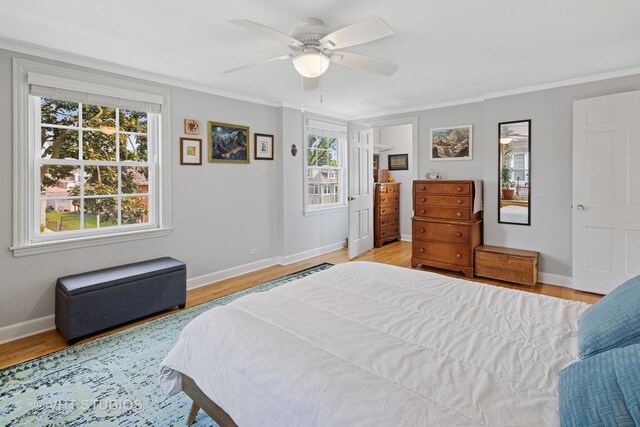 6967 W Wolfram St, Chicago, IL 60634 - bedroom featuring light wood-style flooring, crown molding, and ceiling fan