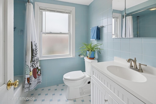 6967 W Wolfram St, Chicago, IL 60634 - bathroom featuring tile walls, vanity, tile patterned floors, and shower / bath combination with curtain