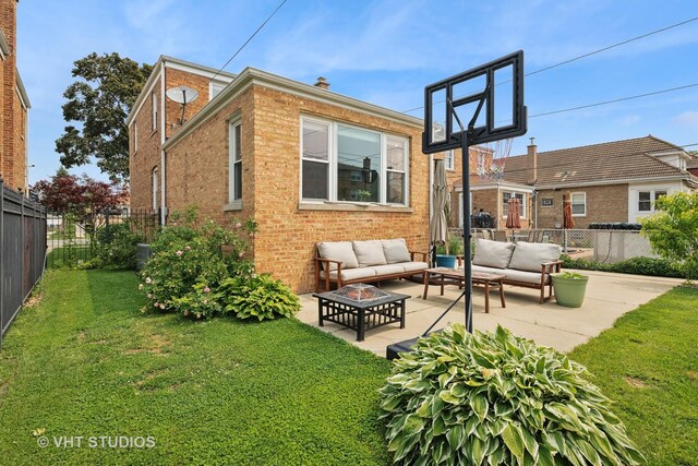 6967 W Wolfram St, Chicago, IL 60634 - rear view of house with outdoor lounge area, brick siding, a fenced backyard, and a patio area