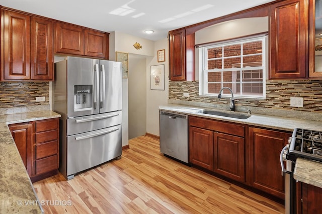 6967 W Wolfram St, Chicago, IL 60634 - kitchen with appliances with stainless steel finishes, light wood-style floors, decorative backsplash, and glass insert cabinets