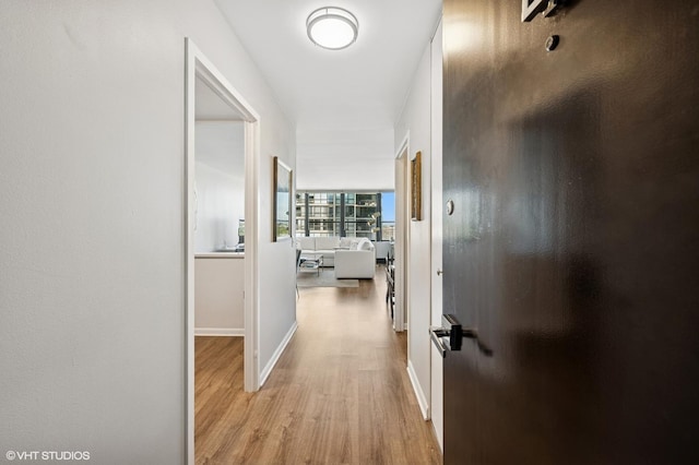1560 N Sandburg Ter Unit 1605J, Chicago, IL 60610 - corridor with light wood-style flooring and baseboards