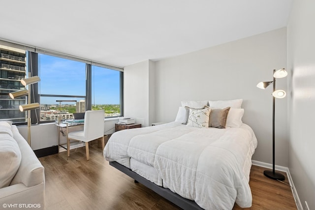 1560 N Sandburg Ter Unit 1605J, Chicago, IL 60610 - bedroom with wood finished floors and baseboards