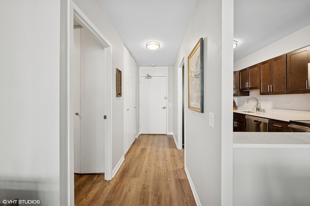 1560 N Sandburg Ter Unit 1605J, Chicago, IL 60610 - hall featuring light wood-style floors, a sink, and baseboards