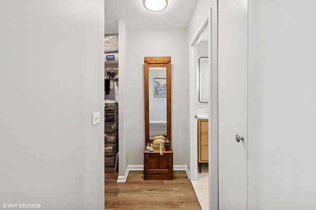 1560 N Sandburg Ter Unit 1605J, Chicago, IL 60610 - hallway with light wood-style flooring and baseboards