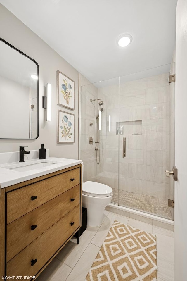 1560 N Sandburg Ter Unit 1605J, Chicago, IL 60610 - full bath featuring toilet, vanity, a stall shower, and tile patterned flooring