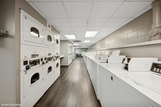 1560 N Sandburg Ter Unit 1605J, Chicago, IL 60610 - communal laundry room featuring estacked washer and dryer, independent washer and dryer, and dark wood-type flooring