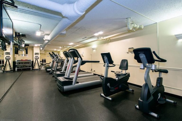 1560 N Sandburg Ter Unit 1605J, Chicago, IL 60610 - gym featuring a textured ceiling