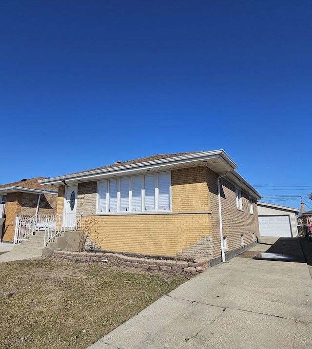 3912 W Hayford St, Chicago, IL 60652 - view of front of home featuring brick siding, an outdoor structure, and a detached garage