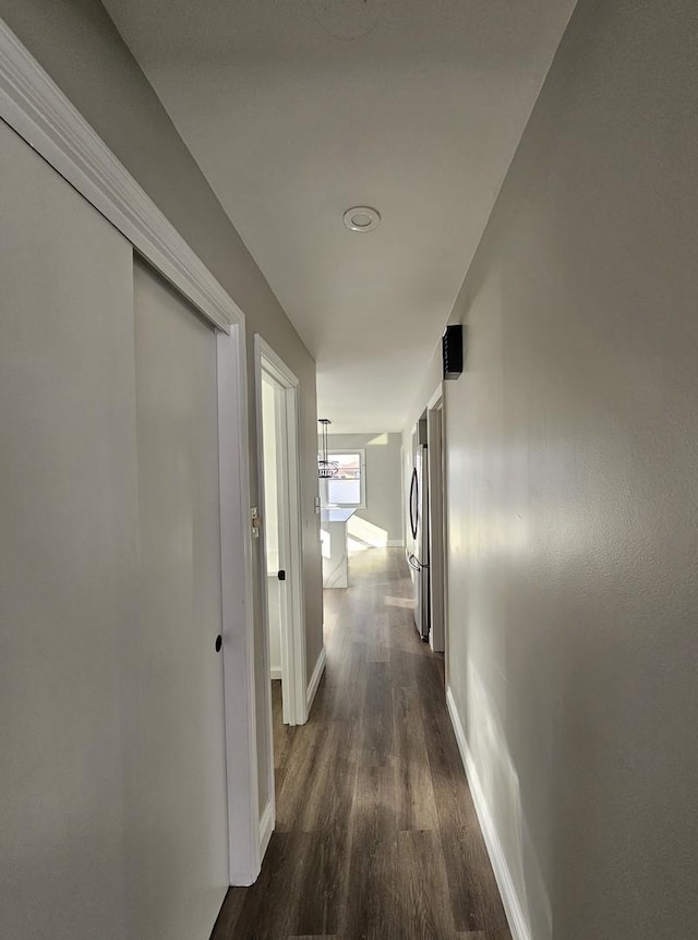 3912 W Hayford St, Chicago, IL 60652 - hallway featuring dark wood-style flooring and baseboards