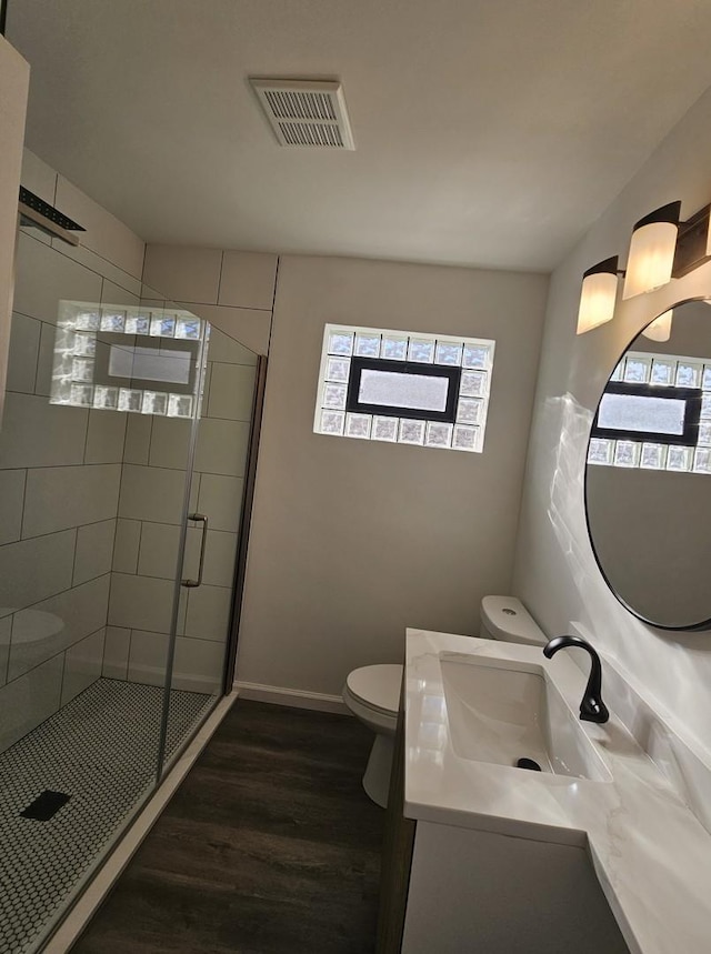 3912 W Hayford St, Chicago, IL 60652 - full bathroom featuring toilet, wood finished floors, a shower stall, vanity, and baseboards