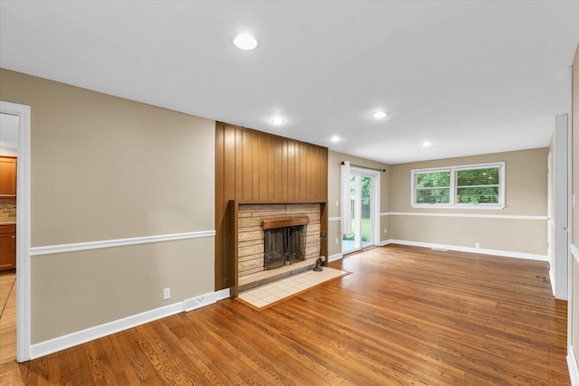 1204 Mayfair Rd, Champaign, IL 61821 - unfurnished living room with light wood finished floors, recessed lighting, and a fireplace