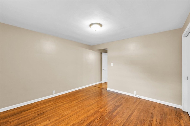 1204 Mayfair Rd, Champaign, IL 61821 - spare room with baseboards and wood finished floors