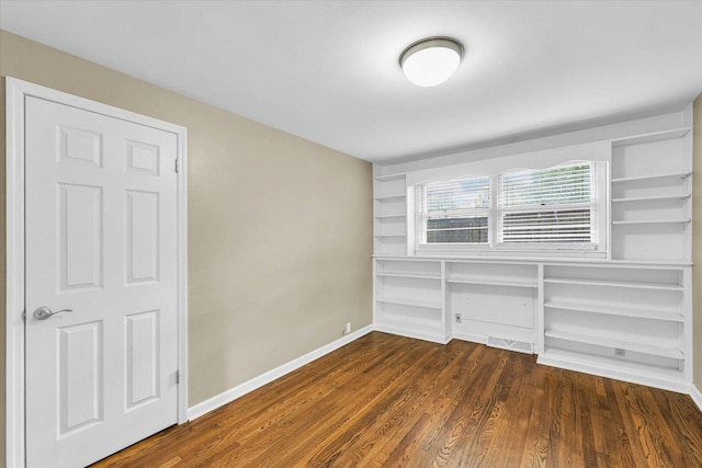 1204 Mayfair Rd, Champaign, IL 61821 - unfurnished bedroom featuring wood finished floors and baseboards