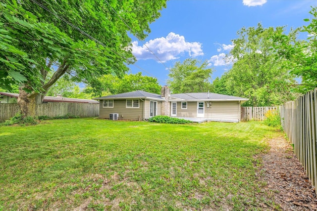 1204 Mayfair Rd, Champaign, IL 61821 - rear view of property with a chimney and a fenced backyard