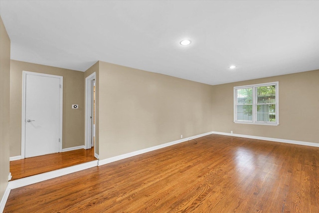 1204 Mayfair Rd, Champaign, IL 61821 - empty room featuring wood finished floors and recessed lighting