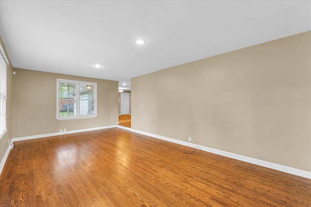 1204 Mayfair Rd, Champaign, IL 61821 - spare room featuring light wood-type flooring and recessed lighting