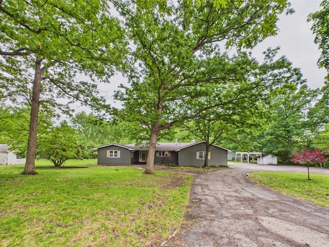 2208 Fiesta Dr, Joliet, IL 60432 - ranch-style house featuring driveway and a front lawn