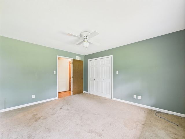 2208 Fiesta Dr, Joliet, IL 60432 - unfurnished bedroom with a closet, baseboards, carpet flooring, and ceiling fan