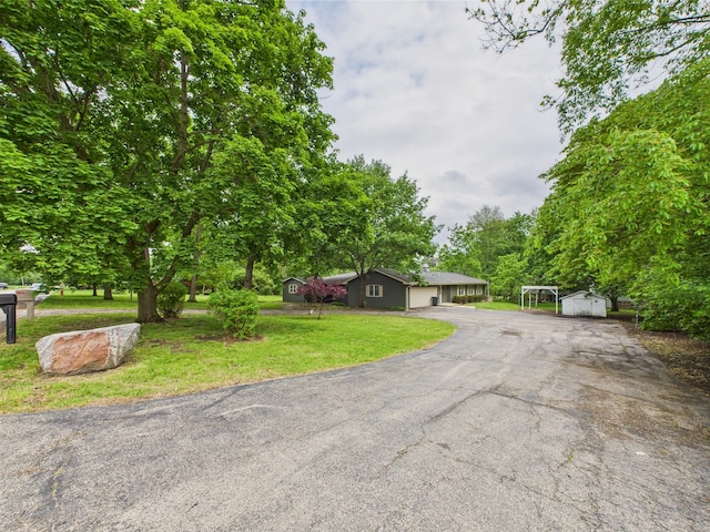 2208 Fiesta Dr, Joliet, IL 60432 - ranch-style home featuring a front lawn and a garage