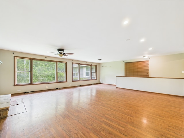 2208 Fiesta Dr, Joliet, IL 60432 - unfurnished living room with ceiling fan, light wood-style floors, baseboards, and recessed lighting