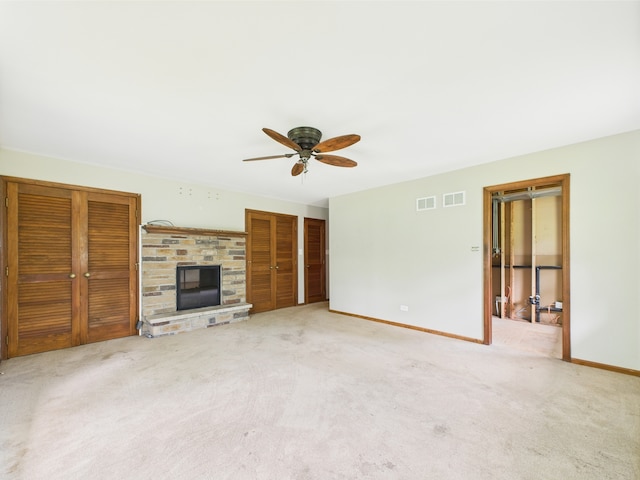 2208 Fiesta Dr, Joliet, IL 60432 - unfurnished living room with a ceiling fan, carpet floors, baseboards, and a fireplace