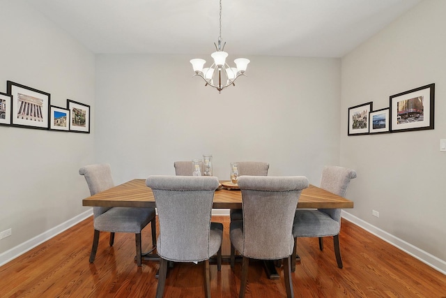 1250 Ashbury Pl Unit 1250, Lemont, IL 60439 - dining space featuring a chandelier, baseboards, and wood finished floors