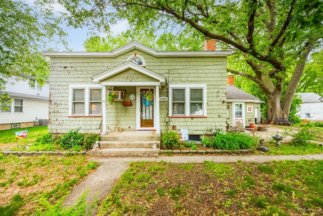 24038 W Oak St, Plainfield, IL 60544 - bungalow-style home featuring a chimney and central AC unit