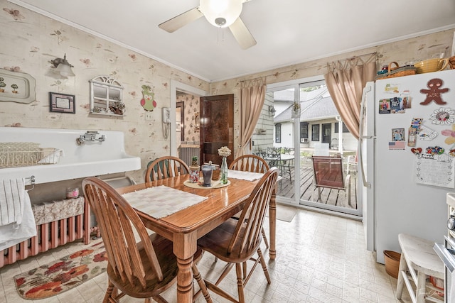 24038 W Oak St, Plainfield, IL 60544 - dining space with ceiling fan, ornamental molding, and wallpapered walls