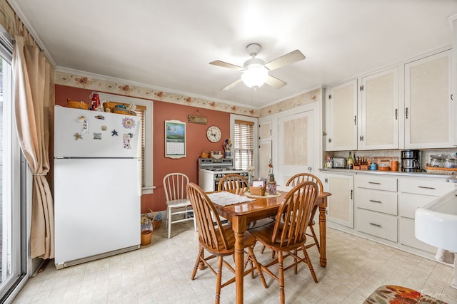 24038 W Oak St, Plainfield, IL 60544 - dining space featuring ceiling fan, light flooring, and ornamental molding