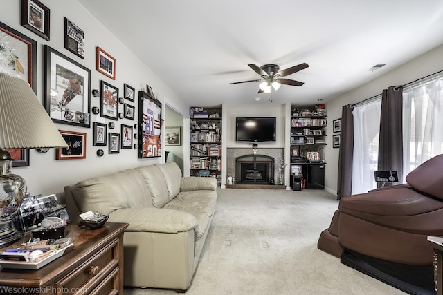 4876 N Hermitage Ave Unit 104, Chicago, IL 60640 - carpeted living area featuring a ceiling fan, a fireplace with raised hearth, and built in shelves