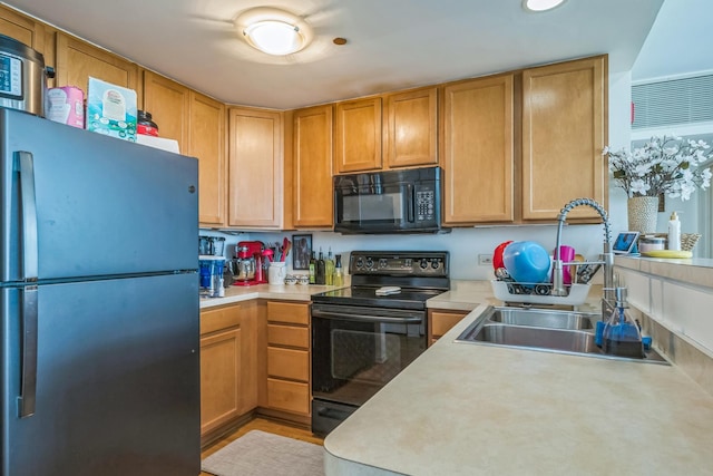 61 W 15th St Unit 407, Chicago, IL 60605 - kitchen featuring black appliances, a sink, and light countertops