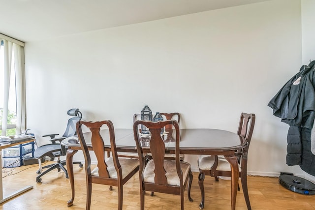 61 W 15th St Unit 407, Chicago, IL 60605 - dining room featuring plenty of natural light, light wood-style floors, and baseboards