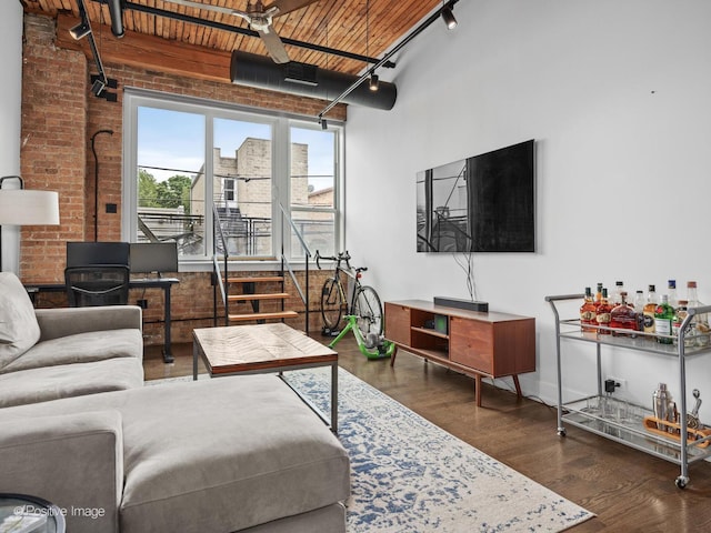 1725 W N Ave Unit 204, Chicago, IL 60622 - living area featuring track lighting, wood finished floors, brick wall, and wood ceiling
