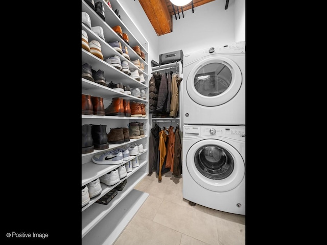1725 W N Ave Unit 204, Chicago, IL 60622 - laundry area with stacked washing machine and dryer and tile patterned floors