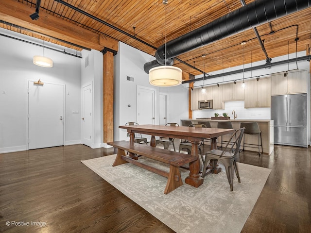 1725 W N Ave Unit 204, Chicago, IL 60622 - dining area featuring dark wood-type flooring, baseboards, and a towering ceiling
