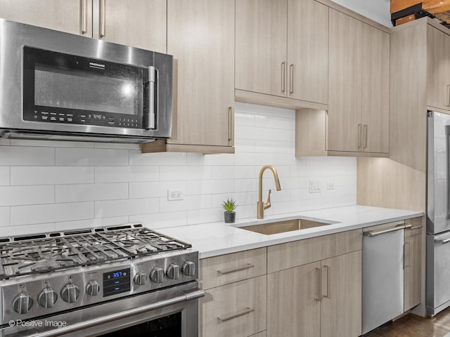 1725 W N Ave Unit 204, Chicago, IL 60622 - kitchen featuring stainless steel appliances, light brown cabinets, a sink, light countertops, and modern cabinets