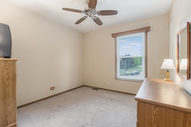 2975 Partridge Ct, Aurora, IL 60502 - unfurnished bedroom with light colored carpet, baseboards, and a ceiling fan