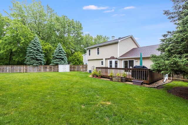 2975 Partridge Ct, Aurora, IL 60502 - back of property featuring a deck, a chimney, and roof with shingles