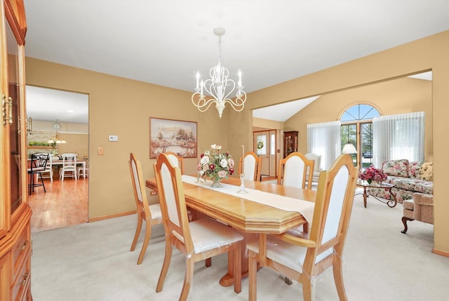 22314 Jeanette Ct, Frankfort, IL 60423 - dining room featuring a chandelier, light colored carpet, vaulted ceiling, and baseboards