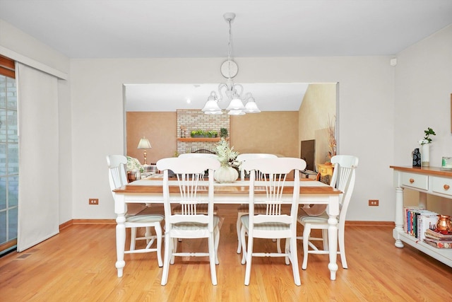 22314 Jeanette Ct, Frankfort, IL 60423 - dining area with wood finished floors, baseboards, and a chandelier