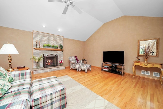 22314 Jeanette Ct, Frankfort, IL 60423 - living room with vaulted ceiling, wood finished floors, a ceiling fan, a brick fireplace, and recessed lighting