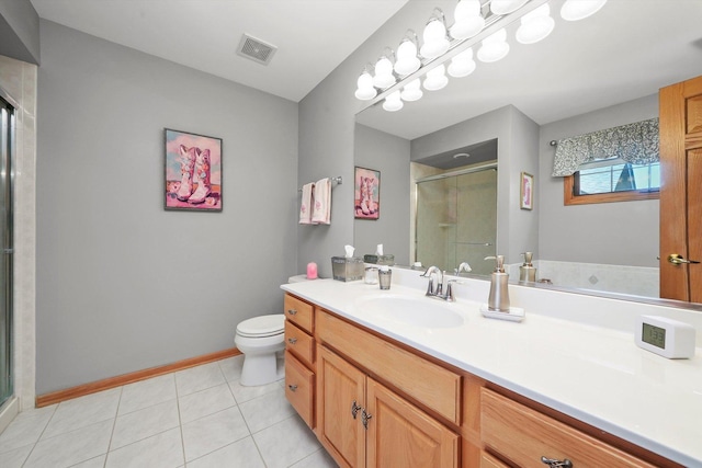 22314 Jeanette Ct, Frankfort, IL 60423 - bathroom with vanity, toilet, a stall shower, baseboards, and tile patterned floors