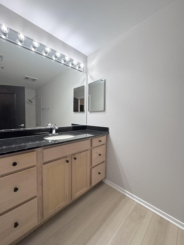 933 W Van Buren St Unit 424, Chicago, IL 60607 - bathroom featuring wood finished floors and vanity