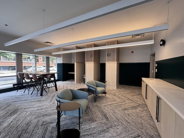 933 W Van Buren St Unit 424, Chicago, IL 60607 - living room featuring beam ceiling and light colored carpet