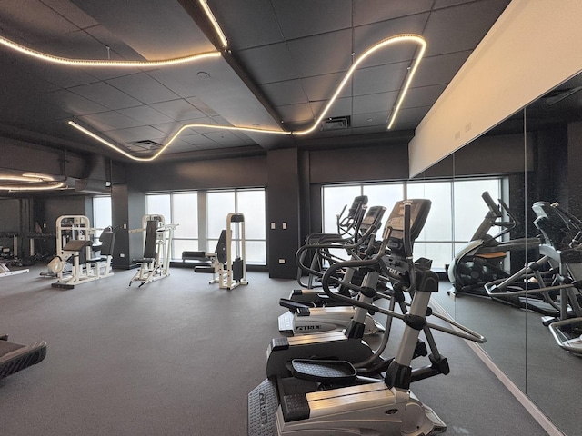 933 W Van Buren St Unit 424, Chicago, IL 60607 - exercise room featuring healthy amount of natural light and a drop ceiling