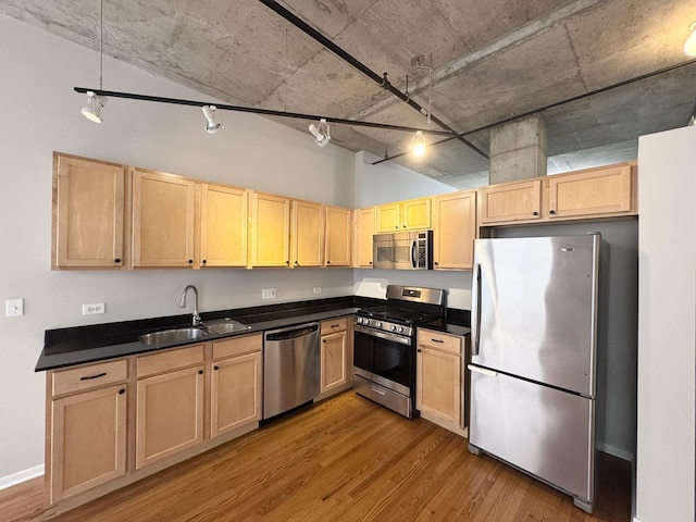 933 W Van Buren St Unit 424, Chicago, IL 60607 - kitchen featuring stainless steel appliances, light brown cabinetry, and wood finished floors