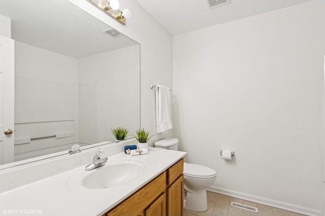 2136 Colonial St, Aurora, IL 60503 - bathroom featuring toilet, vanity, baseboards, and tile patterned floors