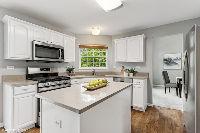 2136 Colonial St, Aurora, IL 60503 - kitchen with appliances with stainless steel finishes, a sink, white cabinetry, and light countertops