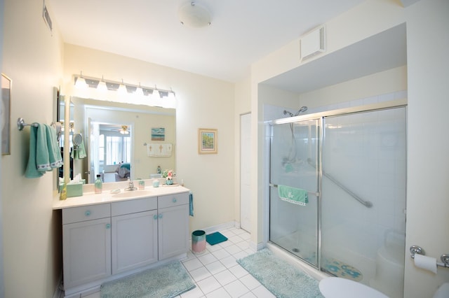8400 Callie Ave Unit 206, Morton Grove, IL 60053 - bathroom with a stall shower, vanity, a ceiling fan, tile patterned flooring, and toilet